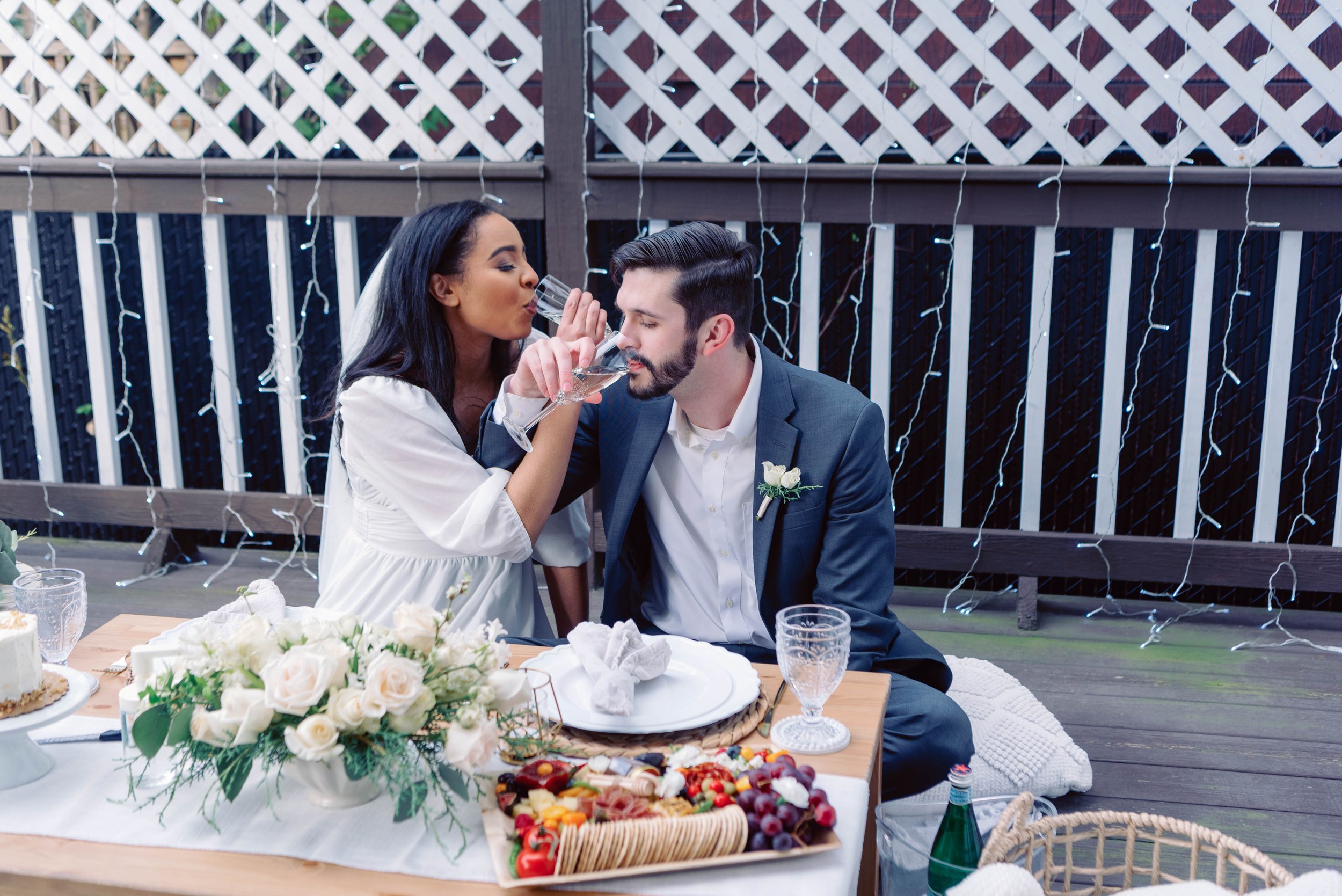 Fun champagne spray and toast during this couple's private picnic on their elopement day. Luxury picnics can be totally customized to fit your elopement day vibe. Let's chat about designing your day!